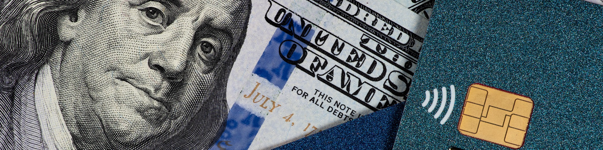 close up of a paper money and a card